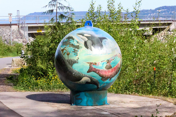 Large buoy art installation painting with sea life such as orca and salmon