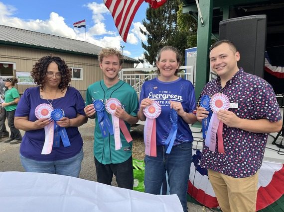 Standing with my ice cream making contest team and holding our most creative and first place ribbons.