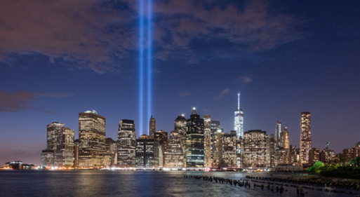 Two rays of light shining up to the sky where the World Trade Centers used to be