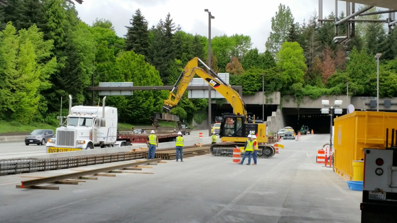 Rail being delivered to the construction site east of the Mercer Island station.