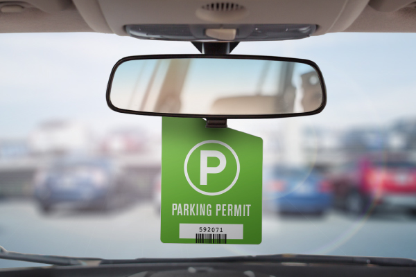 An SOV parking permit hangs from a review mirror.
