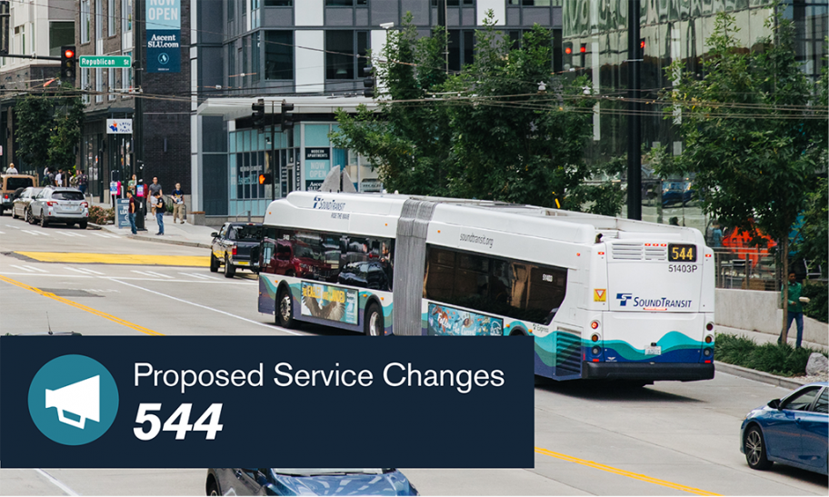 A bus with the number 544 travels through downtown Seattle.