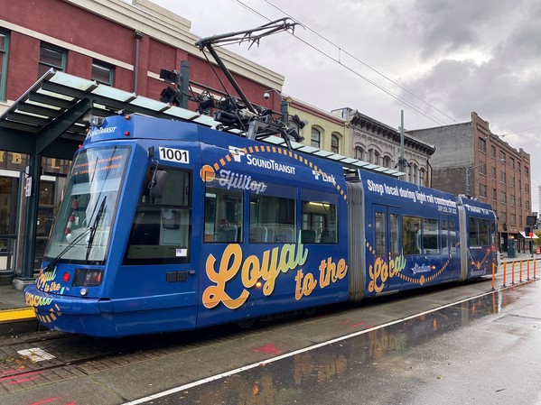 Link light rail vehicle wrapped in "Loyal to the Local" promotional wrap. 