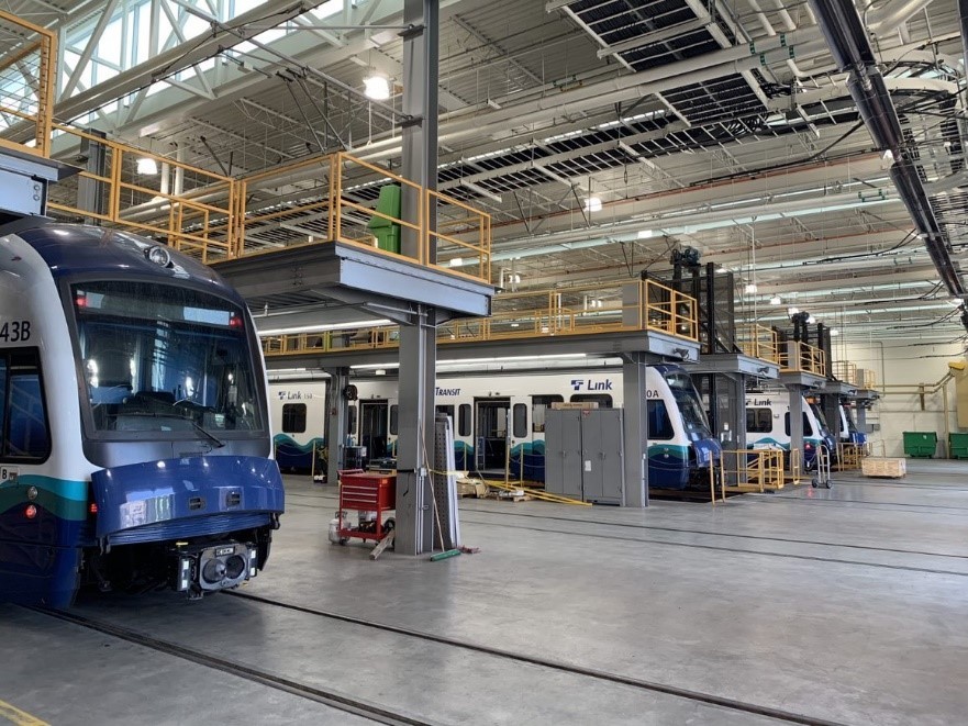Photo of Link Light Rail train at a maintenance facility, Operations and Maintenance Facility South October project update header image