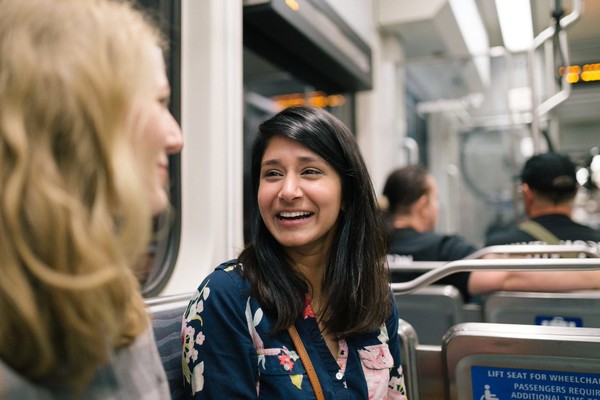 Photo of two women talking on the light rail, West Seattle and Ballard Link Extensions Project update header image