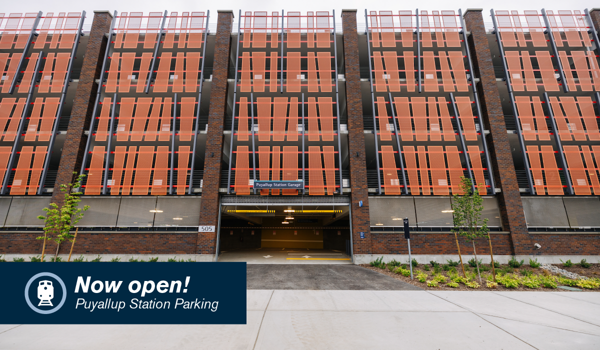 photo of puyallup station garage with text that says "now open"