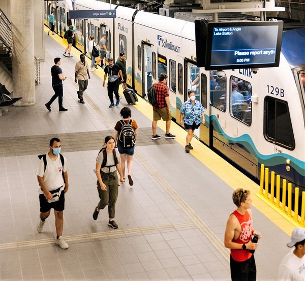 photo of people boarding the Link Light Rail at a station