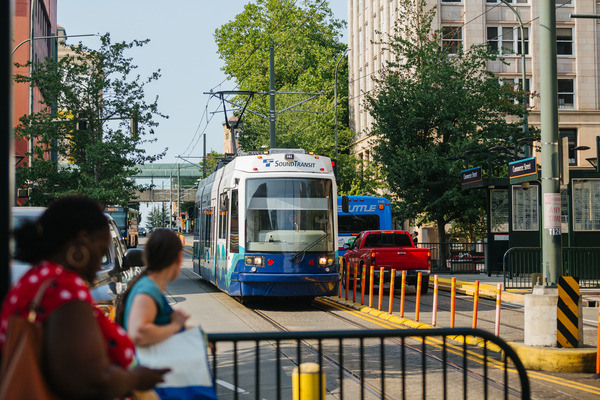 Passengers wait to board the Tacoma Link at Commerce Street station.
