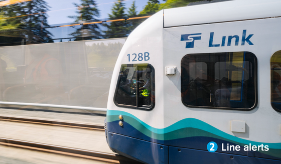 photo of a link light rail engine car with the phrase "2 line alerts" on the bottom right corner