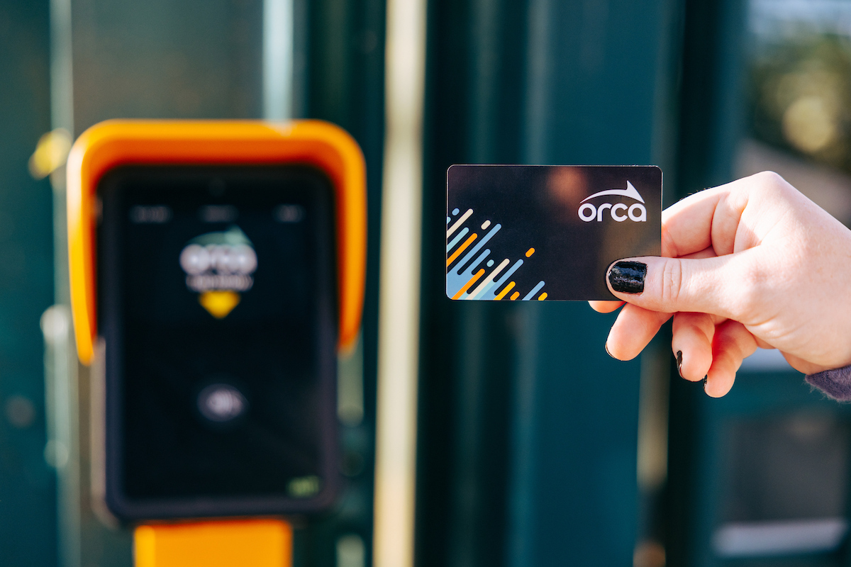 An ORCA card is tapped against a fare media reader