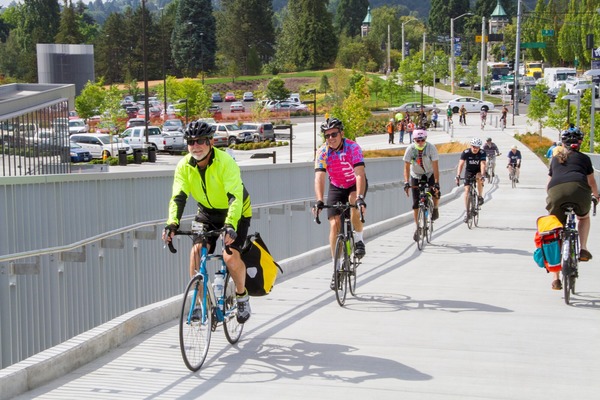 Photo of people bike riding up and down a ramp near the University of Washington Link Station.