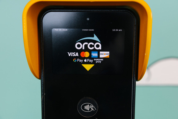 A fare machine display shows the credit cards and digital wallets now accepted to pay for transit.