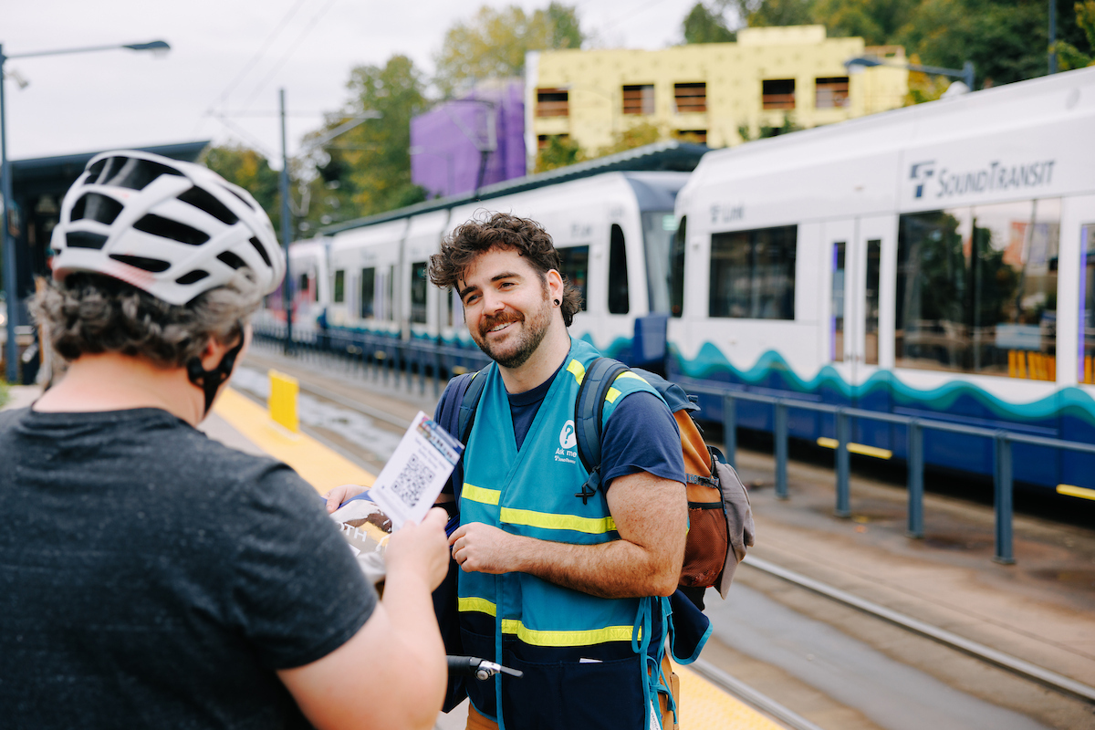 Sound Transit Ambassadors hand out surveys.