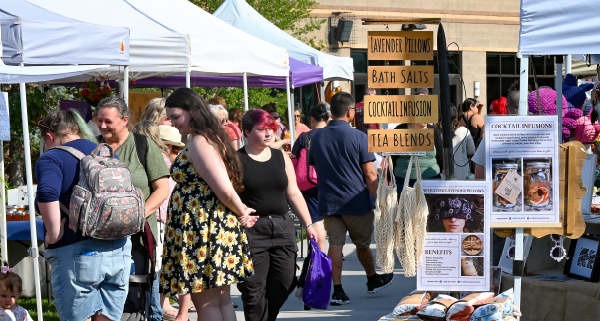 People browsing vendors at the Spokane Valley Farmer's Market