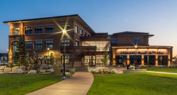 A close front-facing shot of City Hall during the evening