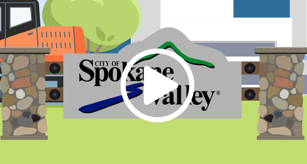 An animated graphic of a City of Spokane Valley sign with a play button icon overlaid on it.