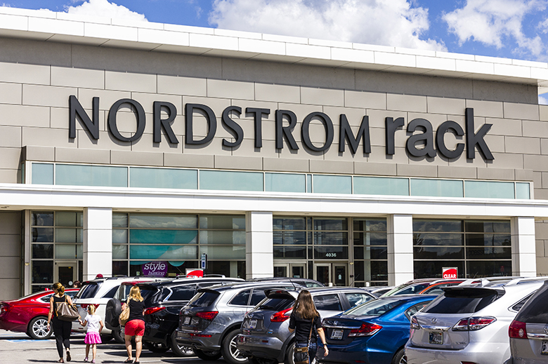 Image of Nordstrom Rack store facade, people and parking lot