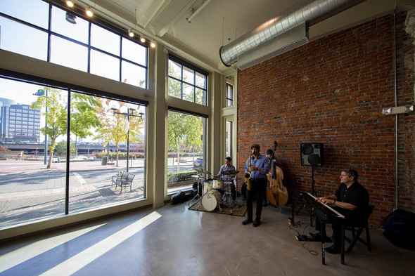 Musicians play in entrance space of KNKX new Tacoma studio