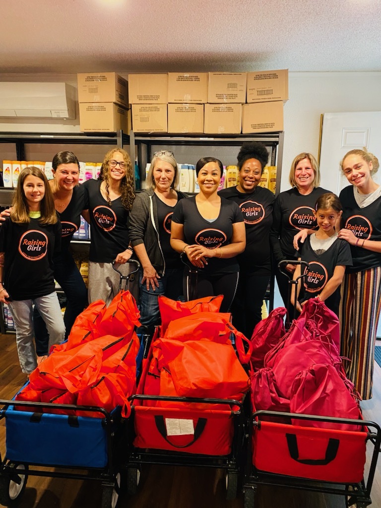  Raising Girls hygiene bag packing event with community volunteers and Tacoma City Council Members.  