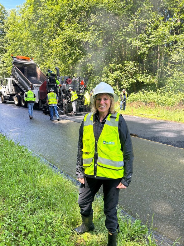 CM Rumbaugh standing in front of Tacoma Public Works Department as they worked to replace and fill parts of Northshore Parkway in NE Tacoma.