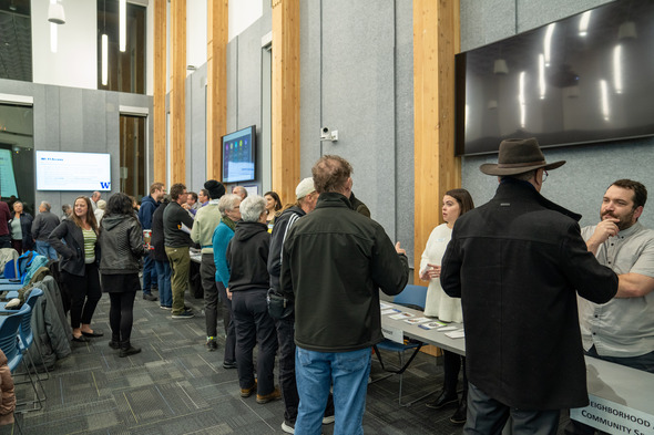 Event attendees talking to stakeholders