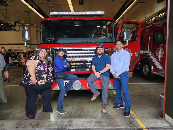 CM Diaz, Mayor Woodards, CM Bushnell and CM Sadalge in front of a new fire engine 