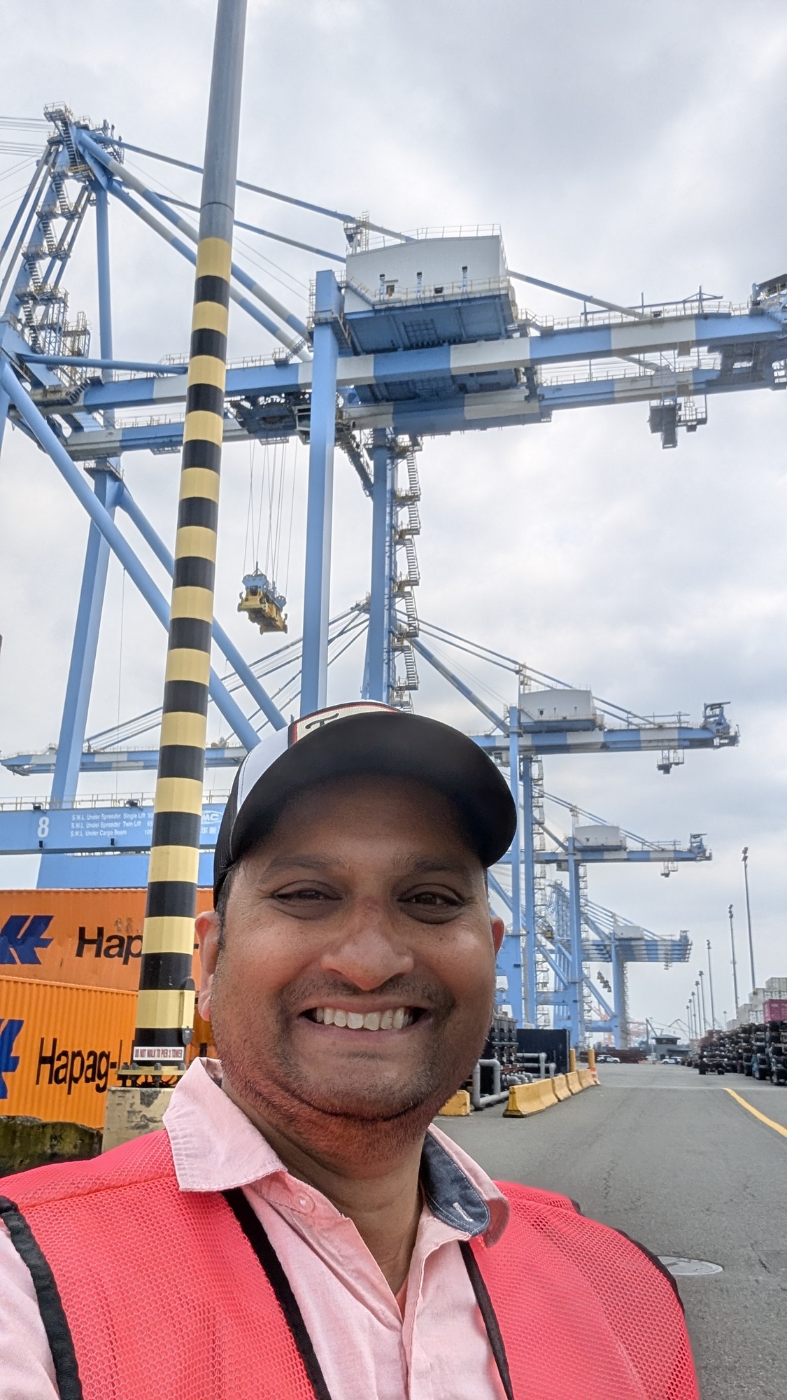 CM Sadalge at the port in front of a crane