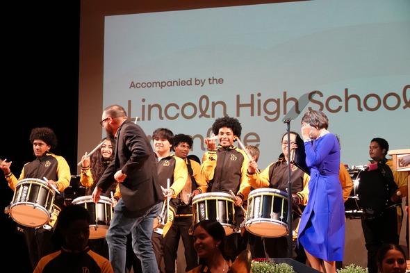 CM Bushnell dancing with the Lincoln High School drum line