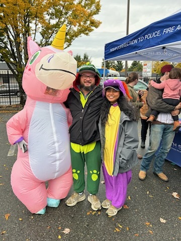 CM Bushnell dressed up as a dinosaur at Hosmer Trunk or Treat