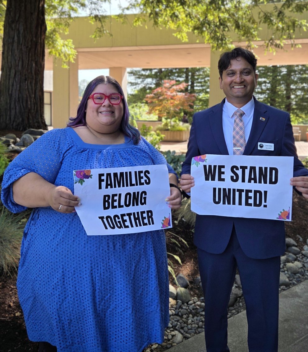 CM Diaz and CM Sadalge holding signs
