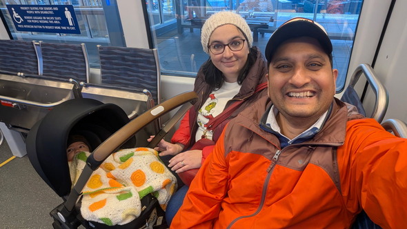 Riding light rail to the airport for holiday travel.