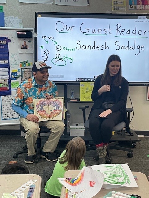 CM Sadalge reading to an elementary school class