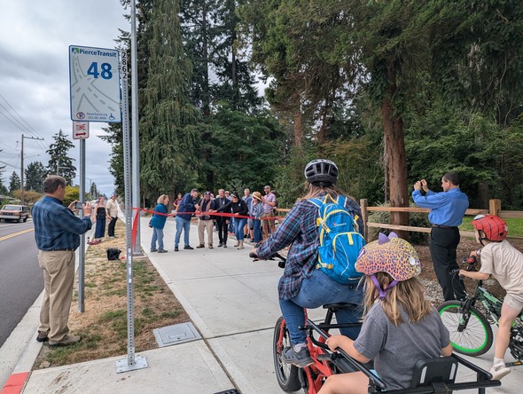 Bicyclists at the ribbon cutting 