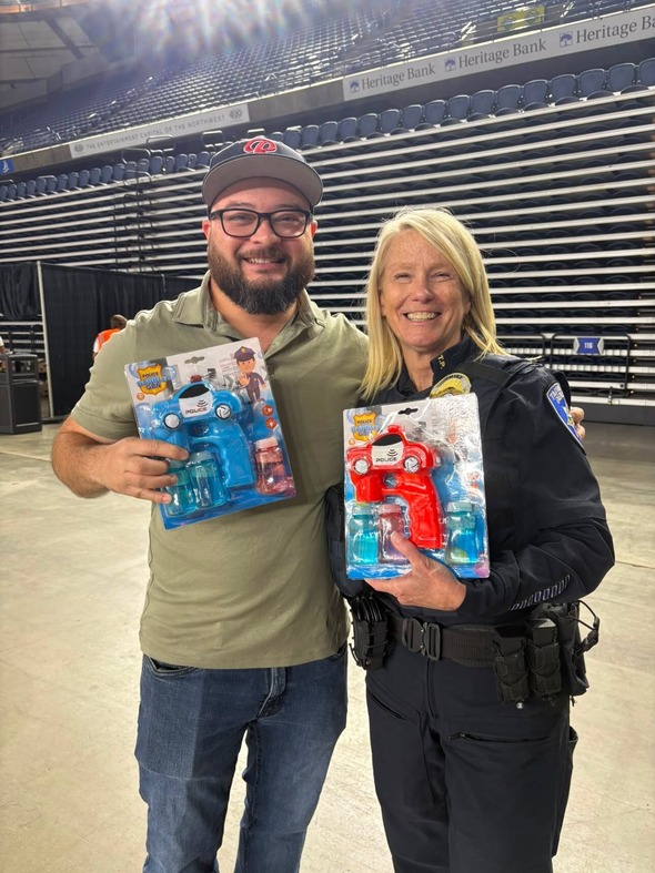 DM Bushnell and TPD Chief holding toys 