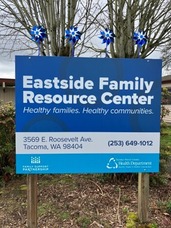 Eastside Family Resource Center sign with pinwheels on top.