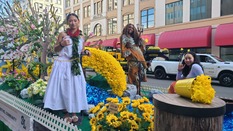 Three young people posing on the Bethel Community Float for the Daffodil Festival.