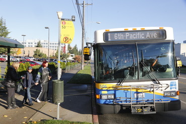 People walking to board public transportation.