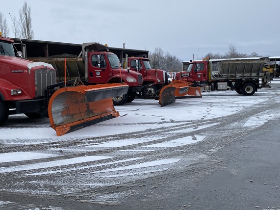 County snow plows in yard