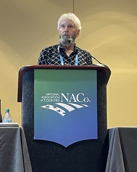 Councilmember Barry Buchanan presents at the 2025 NACo Annual Conference in Philadelphia. 