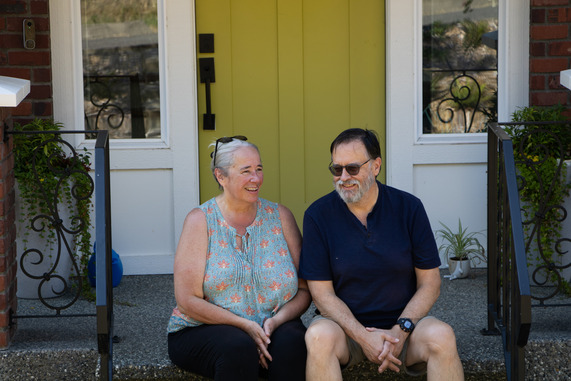 The Walrath's sitting on their front porch smiling