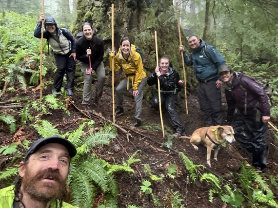 Councilmembers Rienstra, Boyle, and Galloway on a hike on a rainy day