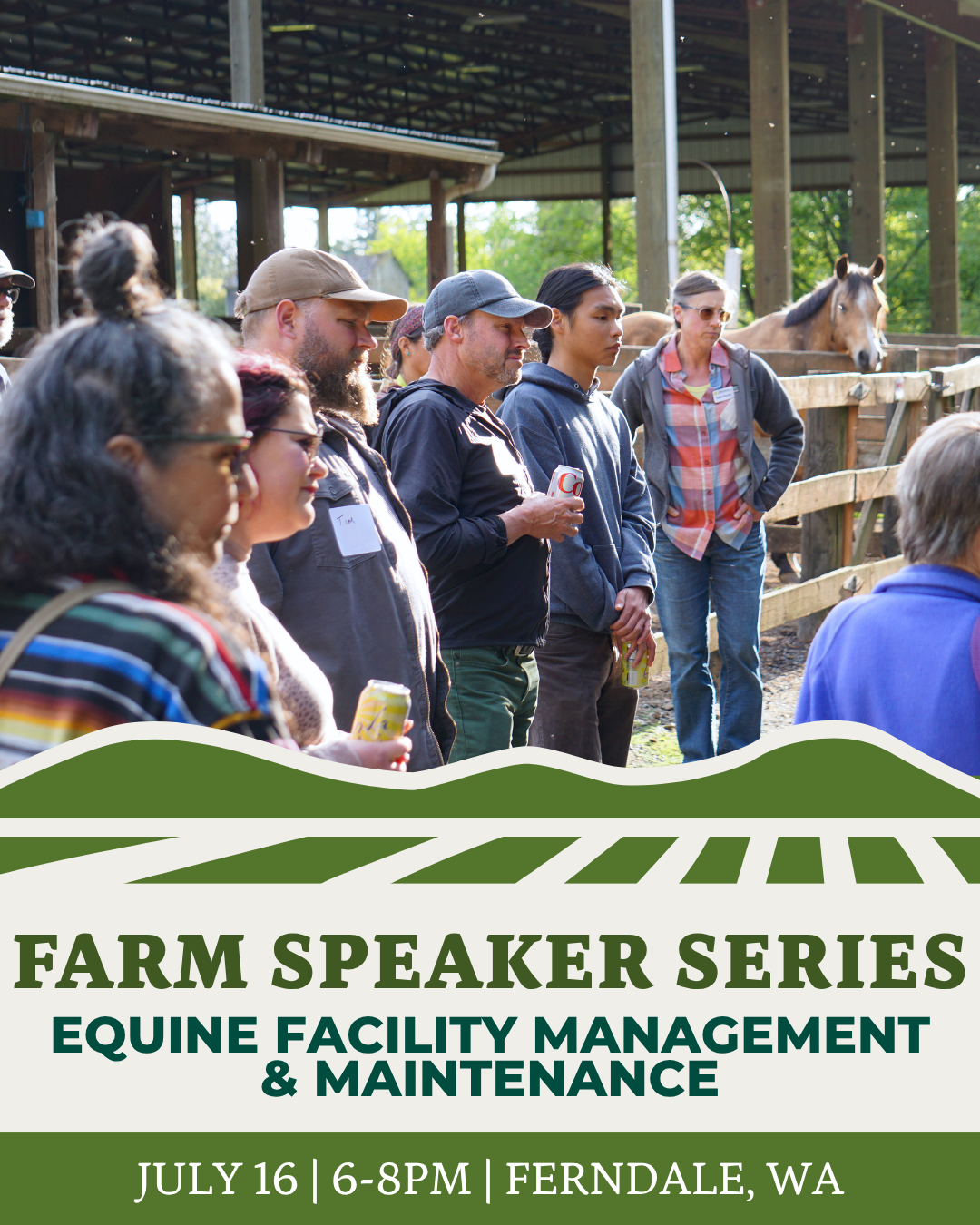 A group of people standing in front of a horse stable listening to a presenter.
