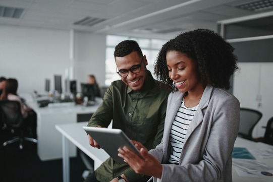 A workforce services manager helps a job seeker.
