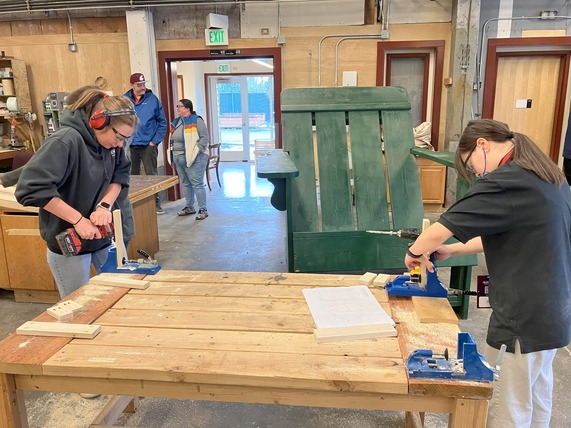 Women carpenters at work.