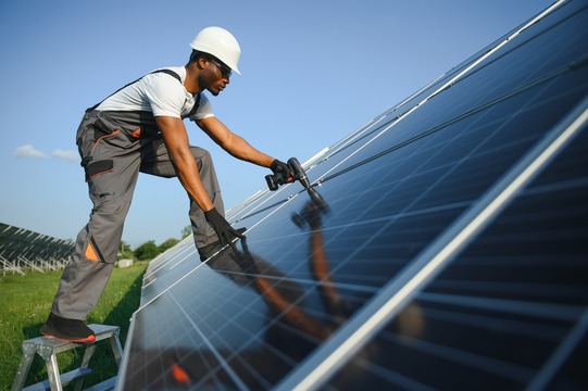 Solar worker installing panels.