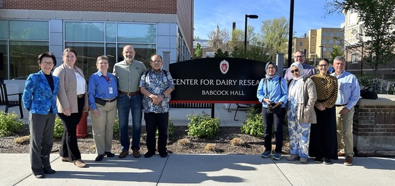 people standing next to CDR sign