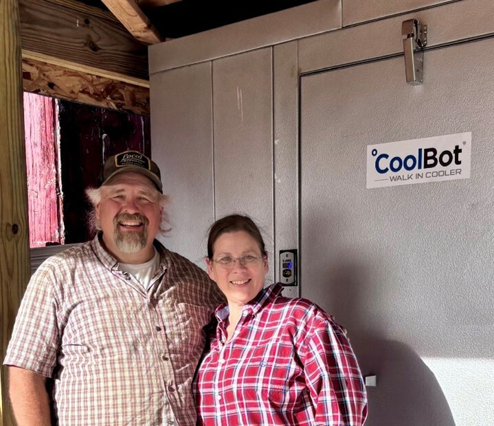 Diana and Adam Diehl posing in front of CoolBot cooler