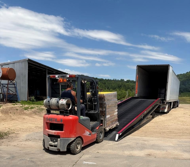 Farm equipment at Ecker's Apple Farm, including a forklift and a truck.