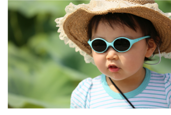 Baby wearing sunglasses and a hat