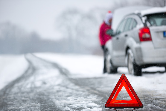 Warning triangle winter car breakdown